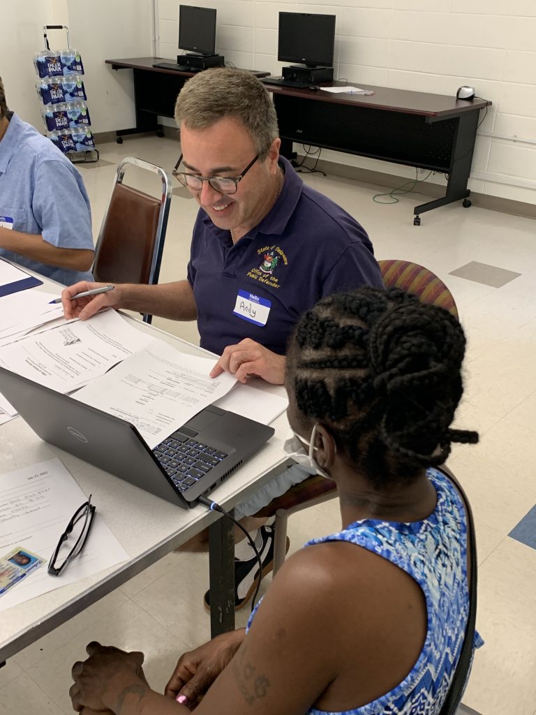 Public Defender Andy Rosen assists a client at July 23rd expungement clinic.